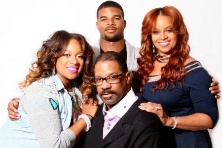 John Drew Sheard poses a picture with his sister Kierra Sheard, mother Karen Clark Sheard and father John Drew Sheard.